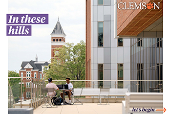 A modern building on the right covers up an older brick building on the left with a view of Tillman hall showing through in the middle.