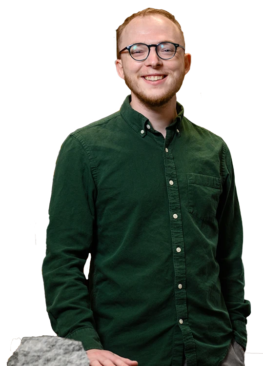A portrait of Clemson master's student William Cummings wearing a dark green button down shirt and glasses, with two-toned orange Tiger stripes in the background.