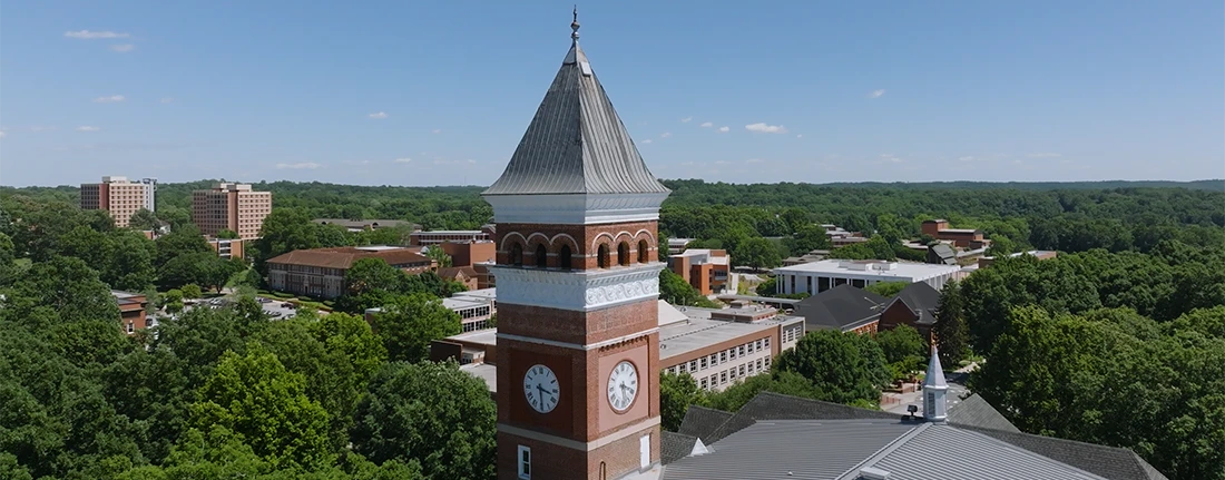 An aerial photo of Clemson's campus, centered on the bell tower.