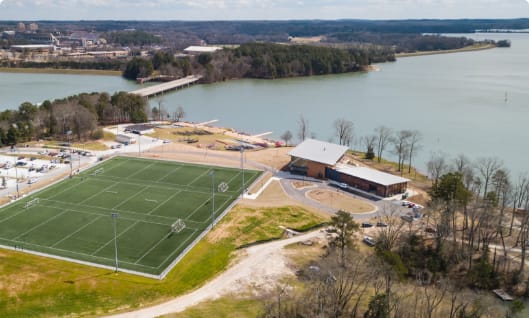 An intramural field and the waters of Lake Hartwell.